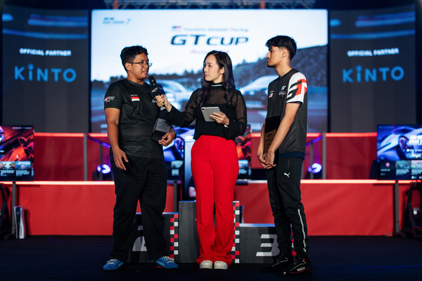 Andika and Taj on stage during the prize ceremony of the Toyota Gazoo Racing (GR) GT Cup Asia Finals.