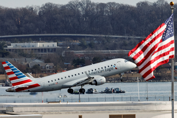 An American Eagle plane takes off at Ronald Reagan Washington National Airport, in the aftermath of the collision of American Eagle flight 5342 and a Black Hawk helicopter that crashed into the Potomac River, in Arlington, Virginia, U.S., 30 January, 2025.