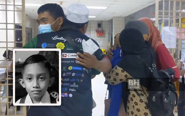 Fahmi's parents are comforted by relatives at Penang General Hospital after receiving news of his passing last night.