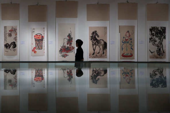 Works by Zhang Daqian (second from right) and Qi Baishi (left, second from left and third from left) that were forged