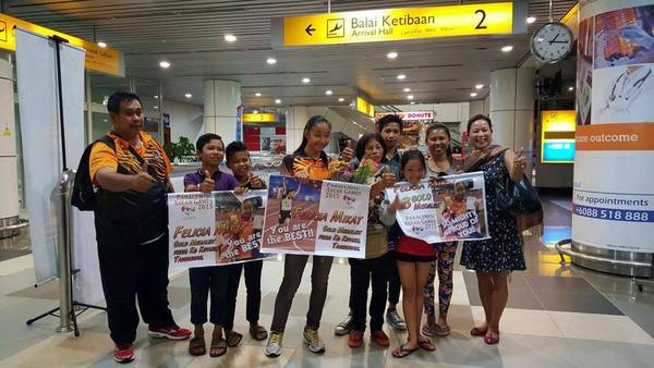 Felicia's extended family is seen welcoming her and her coach Mr. Tony Sawan.