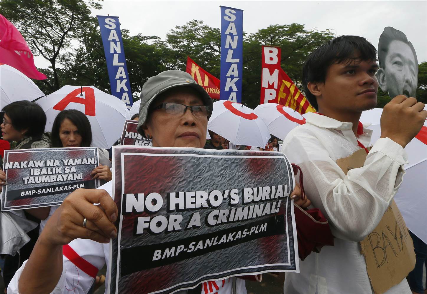 [PHOTOS] Storms Didn’t Scare Rallyists To Protest The Burial Of Marcos ...