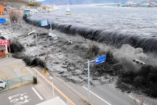 A wave approaches Miyako City from the Heigawa estuary in Iwate Prefecture after the magnitude 8.9 earthquake in March 2011.