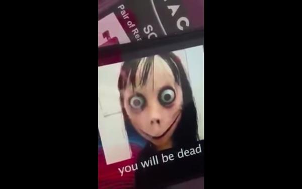 A screenshot allegedly showing "Momo" pop up during a cartoon video.