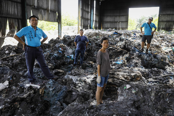 Pua (front, in shorts) with a group of unnamed volunteers.