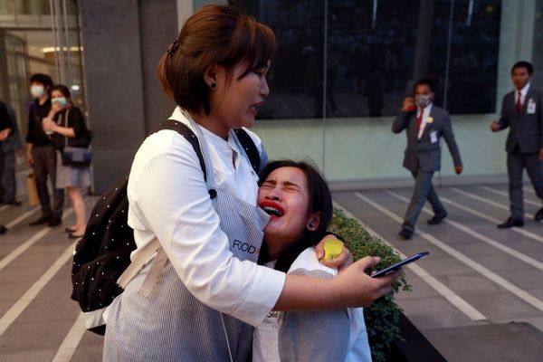 A woman breaks down outside CentralWorld.