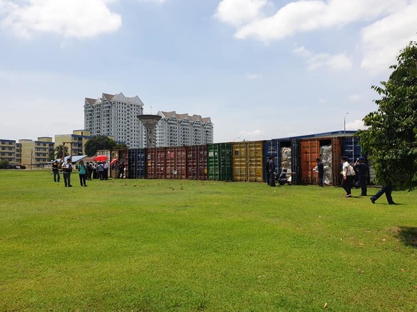 An overview photo of 11 containers at the Customs Detention Depot.