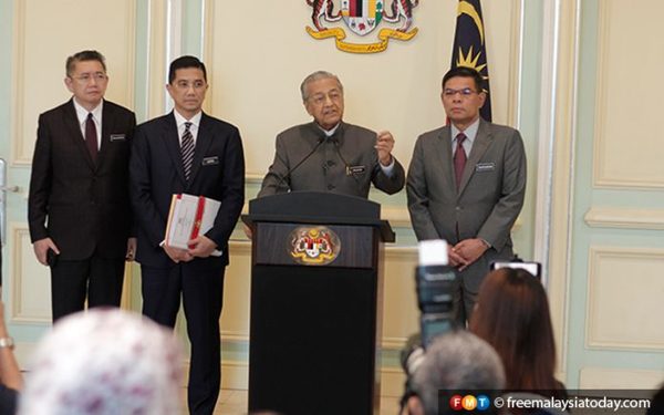 Mahathir speaking during a press conference in Putrajaya today.