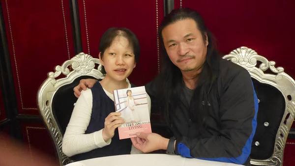 Foong (left) with her book 'A Life Worth Living'.