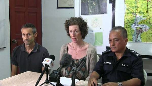 Meabh Quoirin (middle) and her husband Sebastien Quoirin (left) at a press conference.