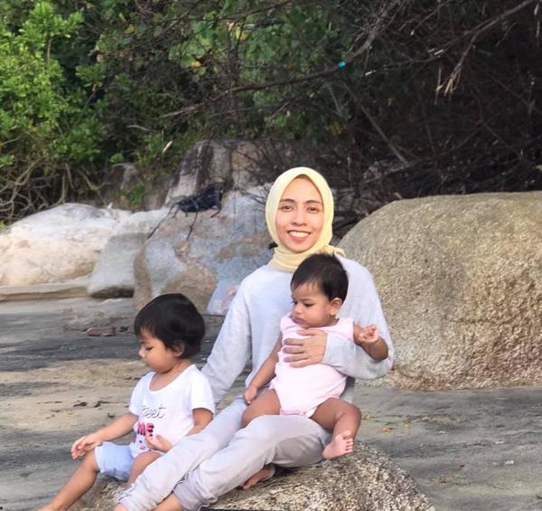 Husna Nadhirah and the couple's two daughters.