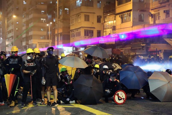 People of Hong Kong defied the official protest ban to turn up for demonstrations across the city.