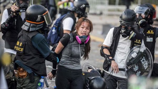 Police detain demonstrators in Hong Kong's Sha Tin district.