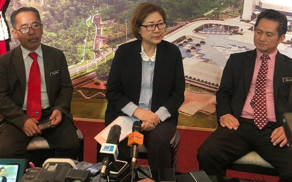 Christina Liew (centre) and Sabah Wildlife Department director Augustine Tuuga (left) speaking to media in Kota Kinabalu yesterday.