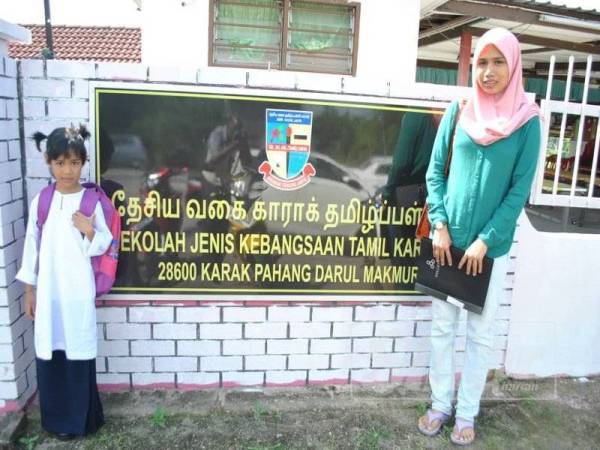 Husna with her mother, Nurul Fadznie Ashikin, at SJKT Karak for Orientation Day last Saturday, 28 December.