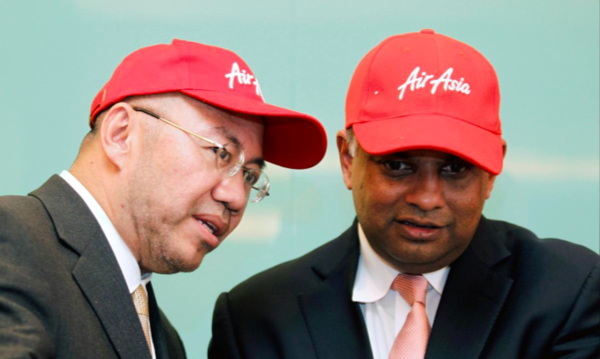 (Left to right) AirAsia Group Berhad's executive chairman Datuk Kamarudin Meranun and  Tony Fernandes.