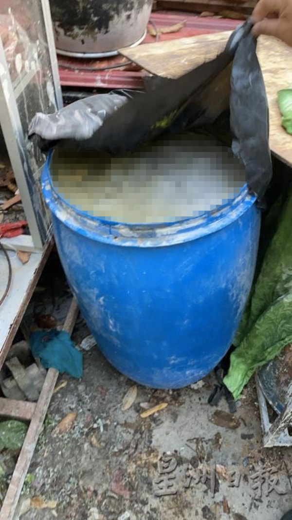 The barrel with Mohd Hasnul's remains covered in cement.