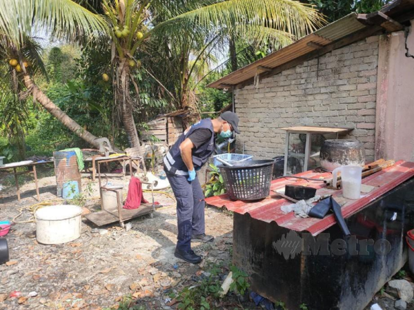 A forensic officer at the crime scene.