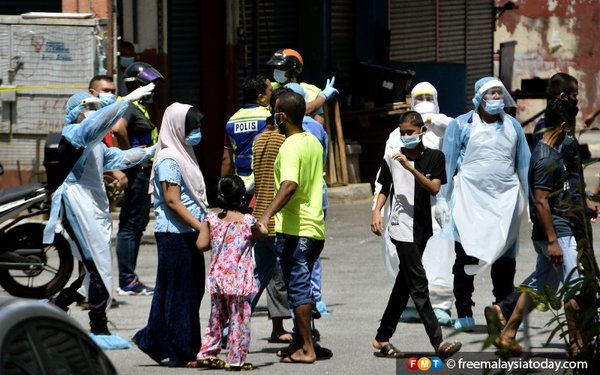 Members of the Rohingya community seen at the Selayang wholesale market area which was placed under lockdown on 20 April.