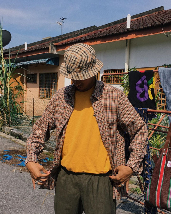 Irfan pictured modelling a couple of thrifted pieces.