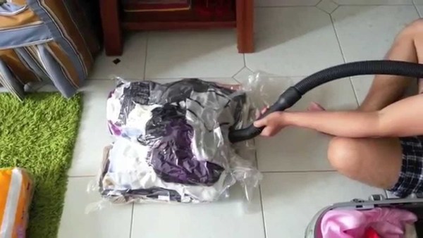 Example of vacuuming a storage bag.