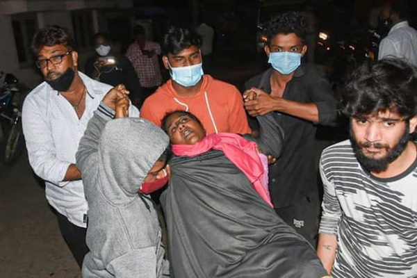 A woman showing symptoms of epilepsy being taken to a hospital in Eluru on 6 December.