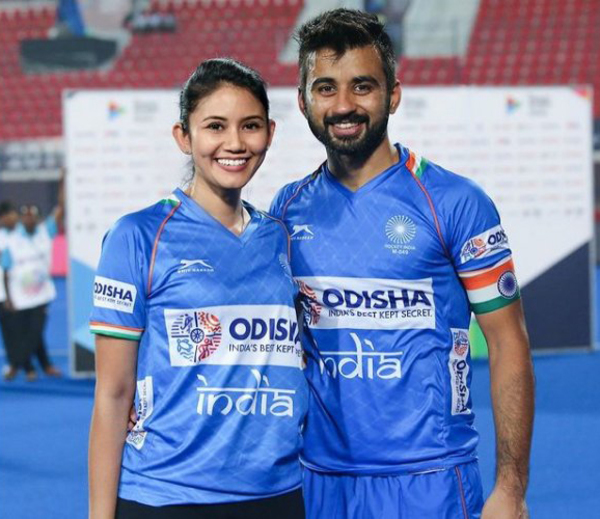 Illi Najwa with Manpreet Singh, both donning the official colours of India men's national field hockey team.