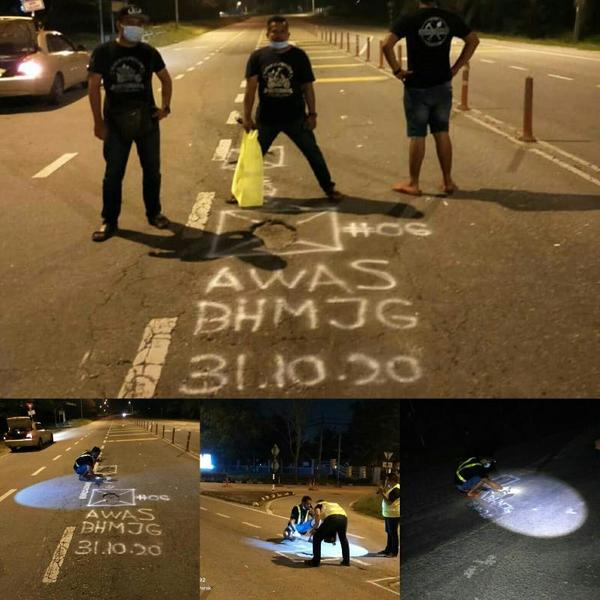 The vigilante Lando Zawawi Brotherhood Malaysia group takes it upon themselves to complete road repairs.