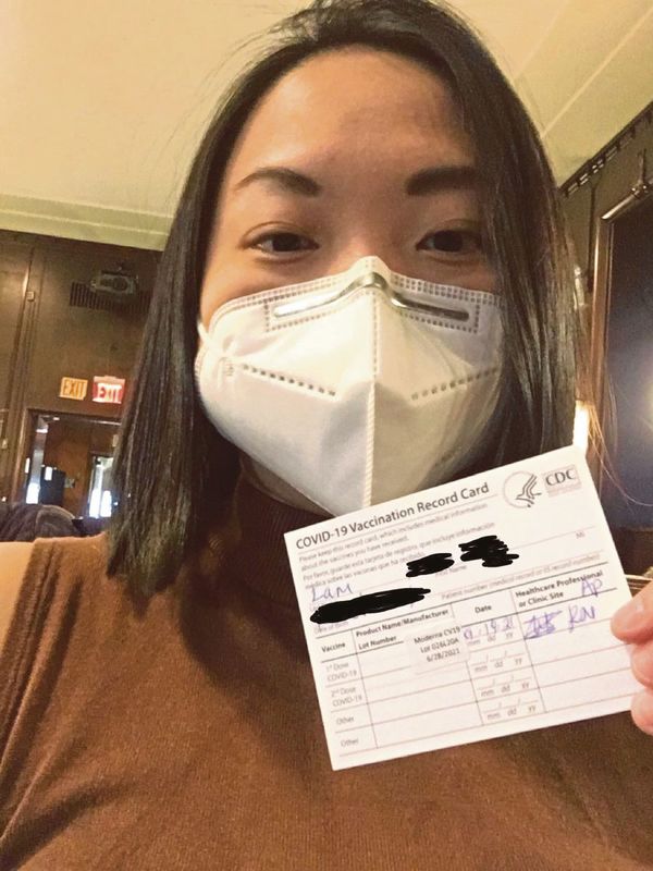 Sharon Lam showing her vaccination card after receiving the first of two doses of the Moderna vaccine in New York.