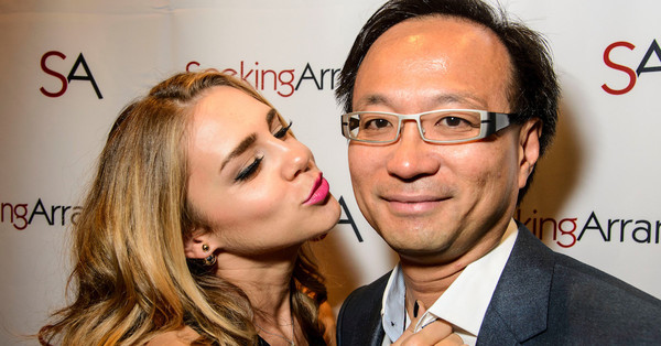 A woman (left) with SeekingArrangement CEO Brandon Wade (right).