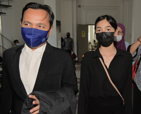 Sam (right) and her lawyer Muhammad Faizal Mokhtar.