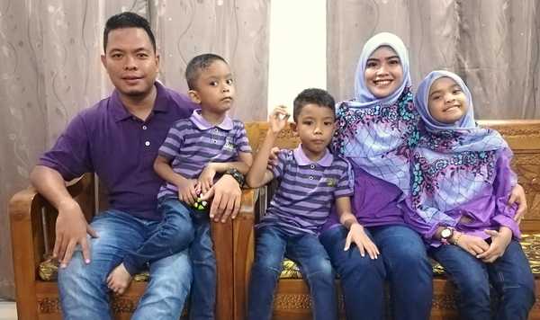 Cikgu Jue with her husband and three children