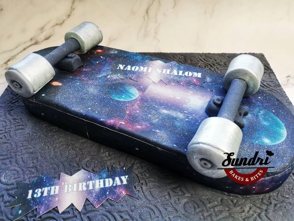 Galaxy skateboard cake.