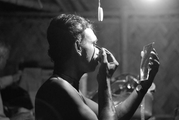 Photo of a jatra actor preparing before the performance for illustration purposes only.