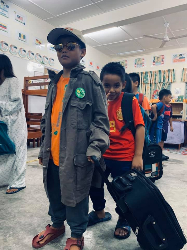 Students get ready to board their make-believe aeroplane.