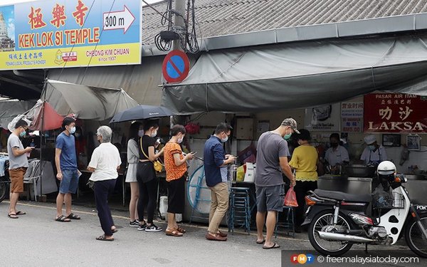 Customers queueing outside the world-famous shop.