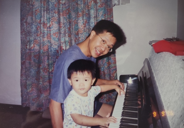 Jeremy with his father, Ng Kok Aun, playing the piano in 1996.