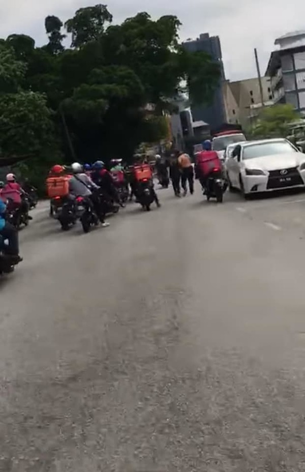 A photo of the delivery riders shared by the Petaling Jaya police.