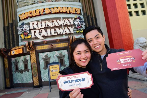 Yeoh and his wife at a Cast-exclusive preview of the Mickey & Minnie Runaway Railway ride at Walt Disney World.