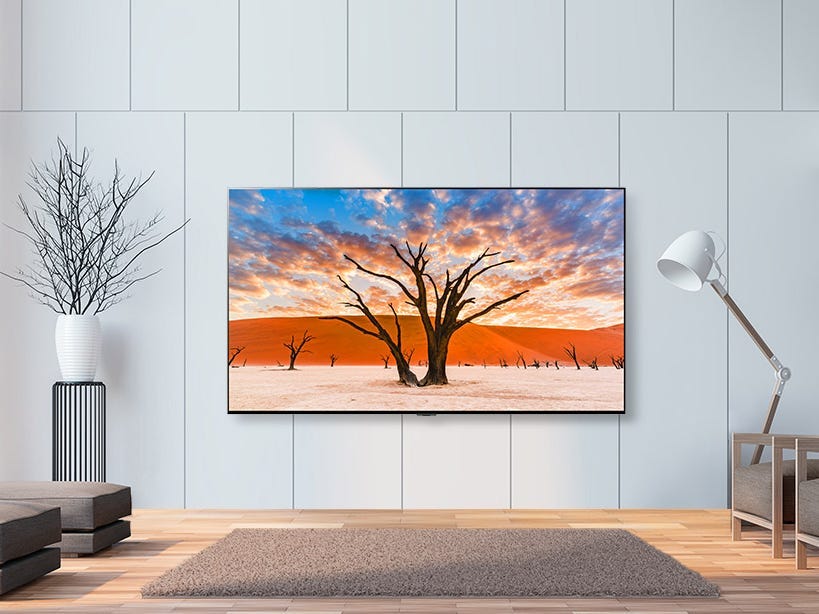 This 65-Inch Smart OLED TV Is Super Thin And Hangs Off Your Wall Like ...