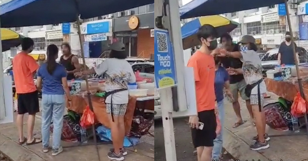 J Shyamalan, dressed in a black singlet, is seen hurling abuse and taunting another customer at the stall on 18 July.