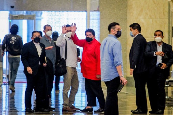 Ku Nan (in red) after having his graft conviction overturned by the Court of Appeal on 16 July.