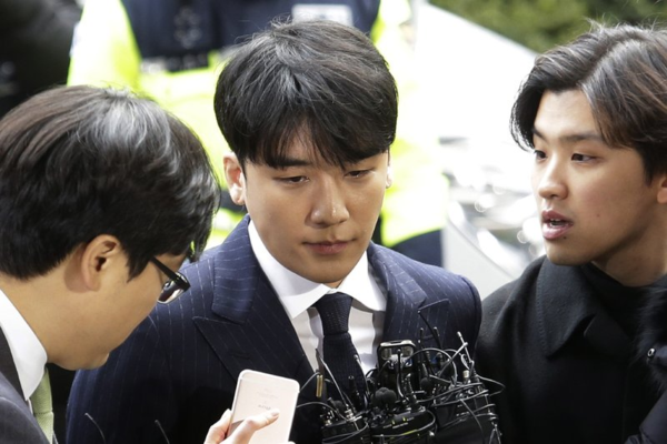 Lee (centre) speaking outside the Seoul Metropolitan Police Agency in Seoul, South Korea in March 2019.