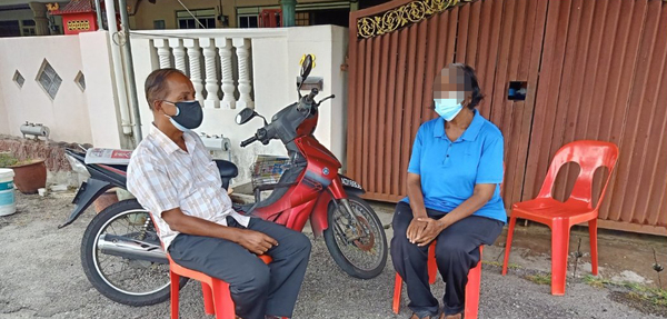 MP Kula with the victim's wife.