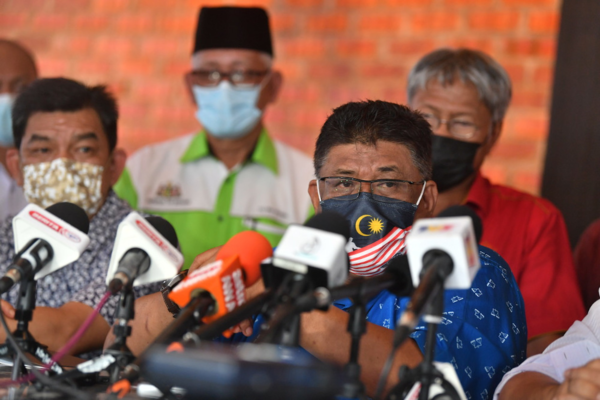 Melaka Assembly Speaker Datuk Seri Ab Rauf Yusoh (right).