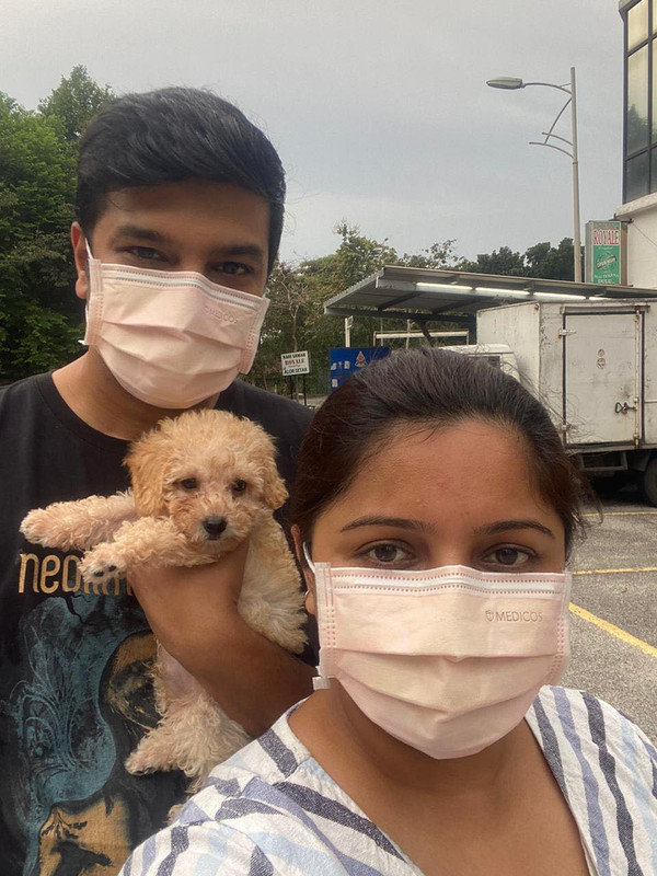 Jayanth, his wife Bhumika, and Peanut.