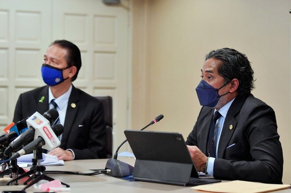 Khairy (right) speaking at a COVID-19 update press conference with Health director-general Tan Sri Dr Noor Hisham Abdullah (left) on Thursday, 21 October.