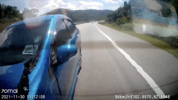 A screenshot of the dashcam footage showing the Perodua Bezza crashing into the back of Nur Syafiqah's car.