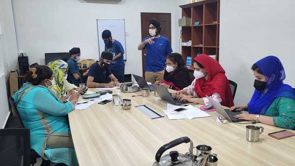 The volunteers handling the flood crisis helpline at the Gurudwara Sahib Petaling Jaya.