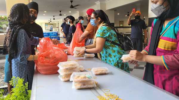 Volunteers prepare the food boxes.